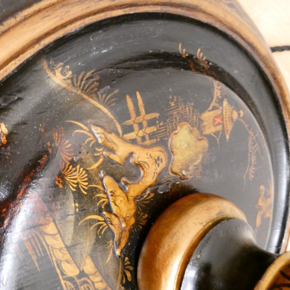 An Edwardian black lacquered standard lamp featuring hand-painted gold Chinoiserie motifs along a turned central shaft, resting on a moulded base with a fabric tassel shade. View IV