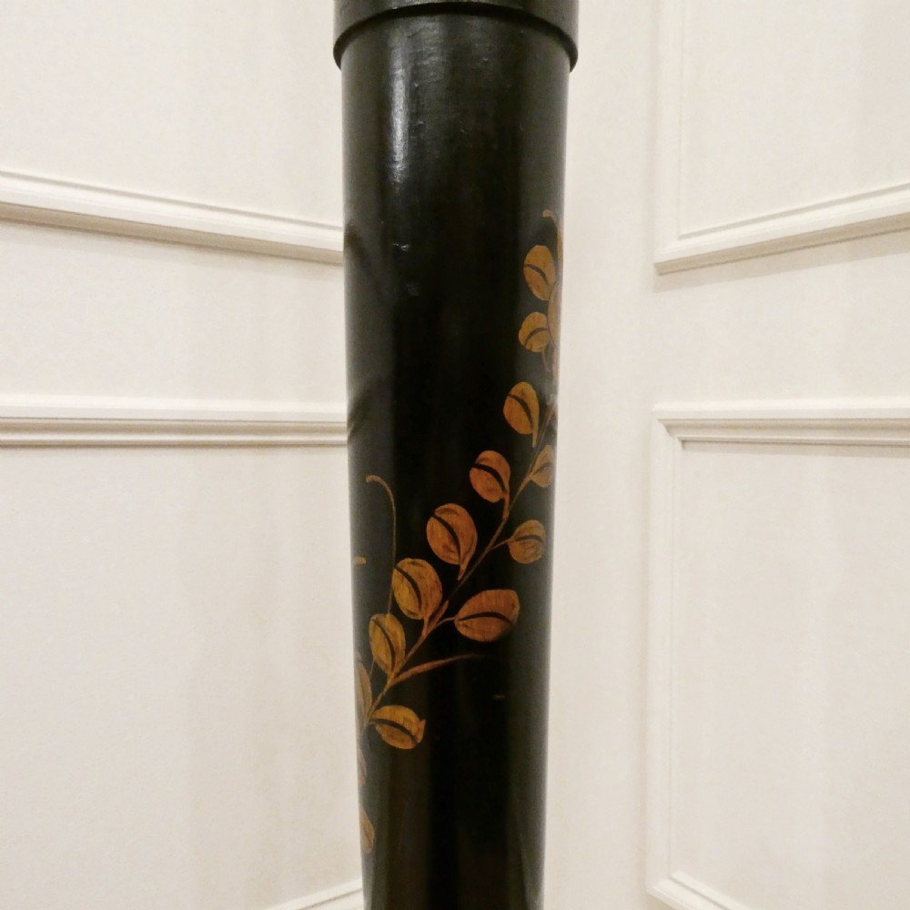 An Edwardian black lacquered standard lamp featuring hand-painted gold Chinoiserie motifs along a turned central shaft, resting on a moulded base with a fabric tassel shade. View VIII