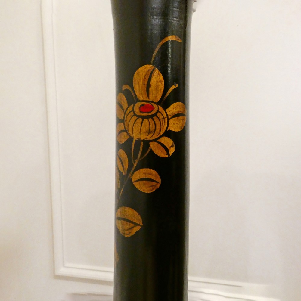 An Edwardian black lacquered standard lamp featuring hand-painted gold Chinoiserie motifs along a turned central shaft, resting on a moulded base with a fabric tassel shade. View IX