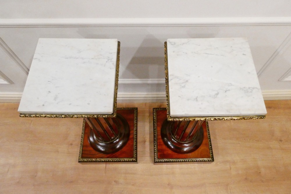 A pair of Victorian fluted satinwood column pedestals with square white marble tops and gilt mounts on plinth bases. View XII