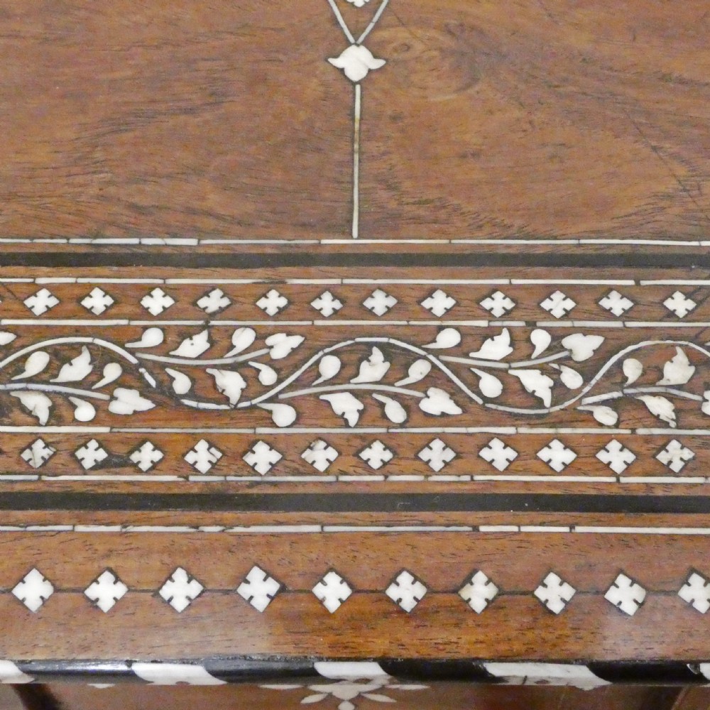Late 19th-century octagonal wooden side table featuring intricate geometric bone inlay and an architectural arched base. View VI