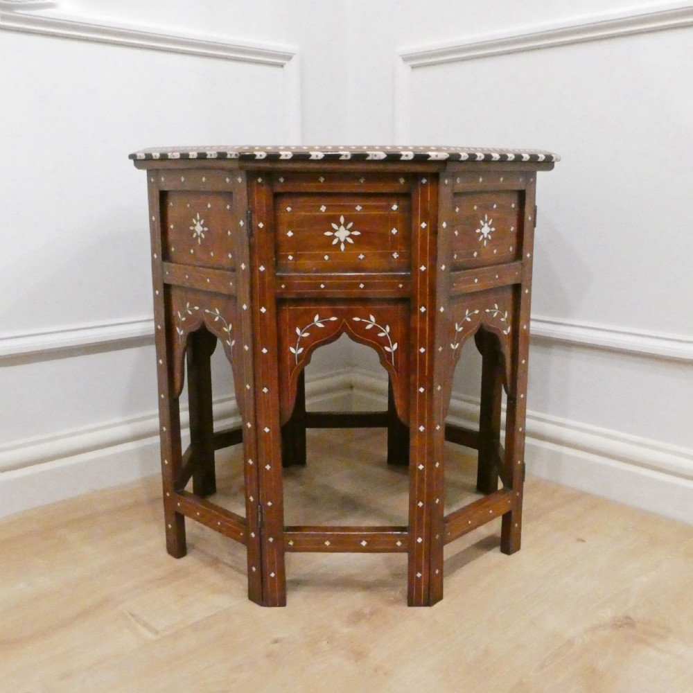 Late 19th-century octagonal wooden side table featuring intricate geometric bone inlay and an architectural arched base. View VIII