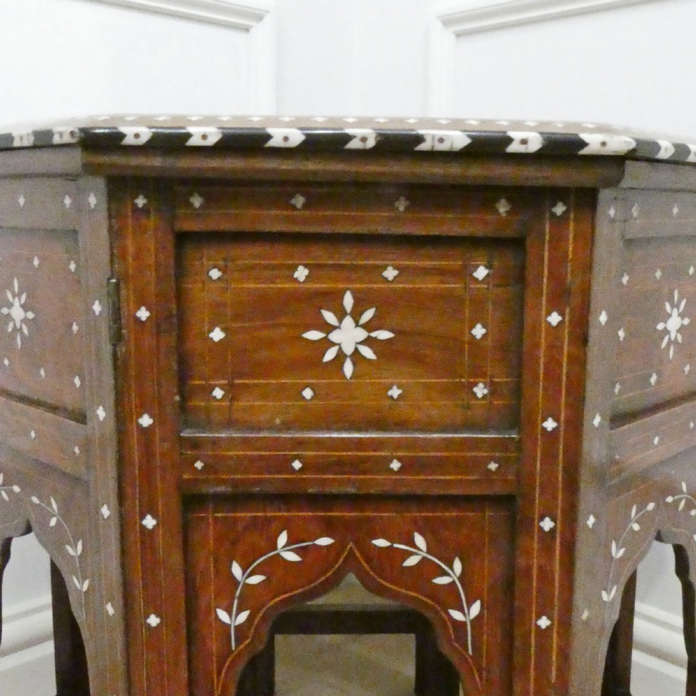 Late 19th-century octagonal wooden side table featuring intricate geometric bone inlay and an architectural arched base. View IX