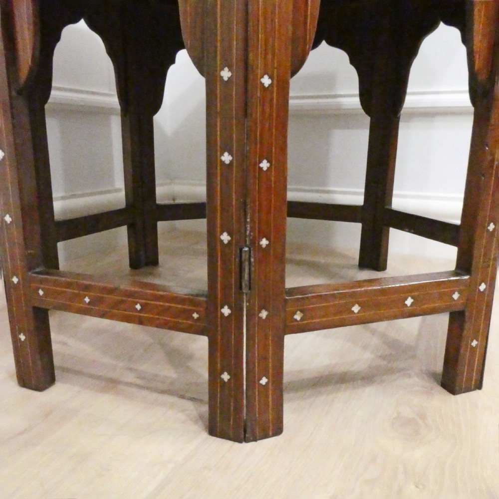 Late 19th-century octagonal wooden side table featuring intricate geometric bone inlay and an architectural arched base. View XI