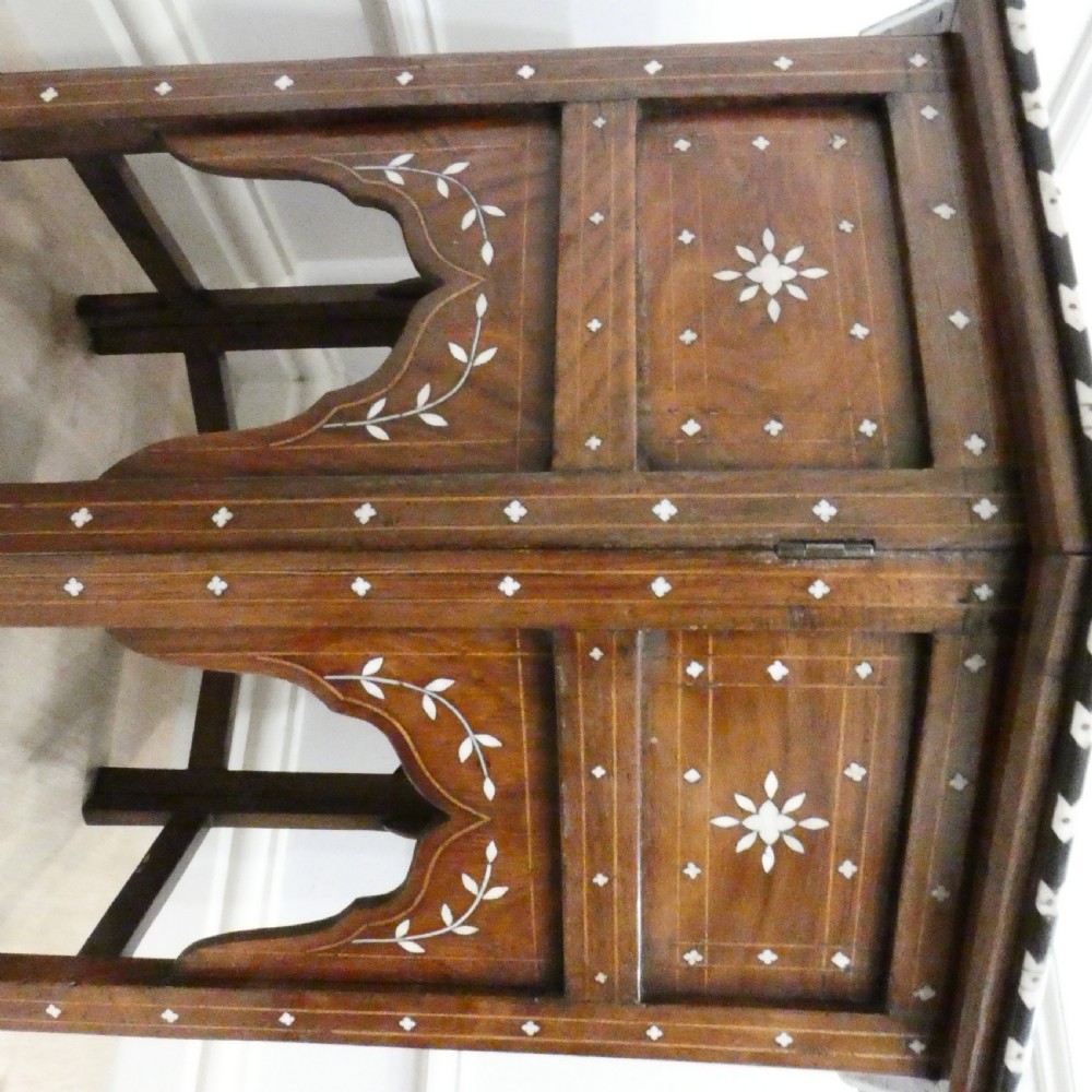 Late 19th-century octagonal wooden side table featuring intricate geometric bone inlay and an architectural arched base. View XII