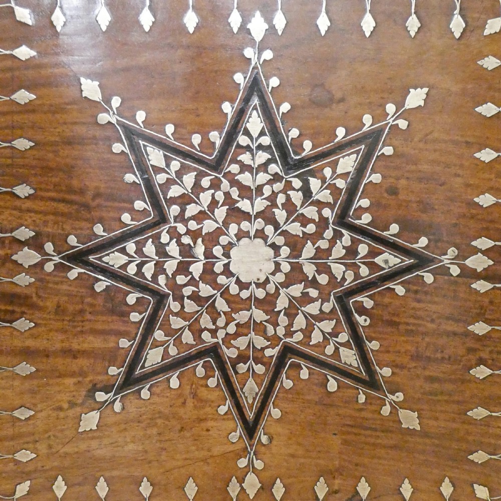 A late 19th-century square Anglo-Indian side table featuring brass inlay with a central star motif and pierced carved wood aprons. View III