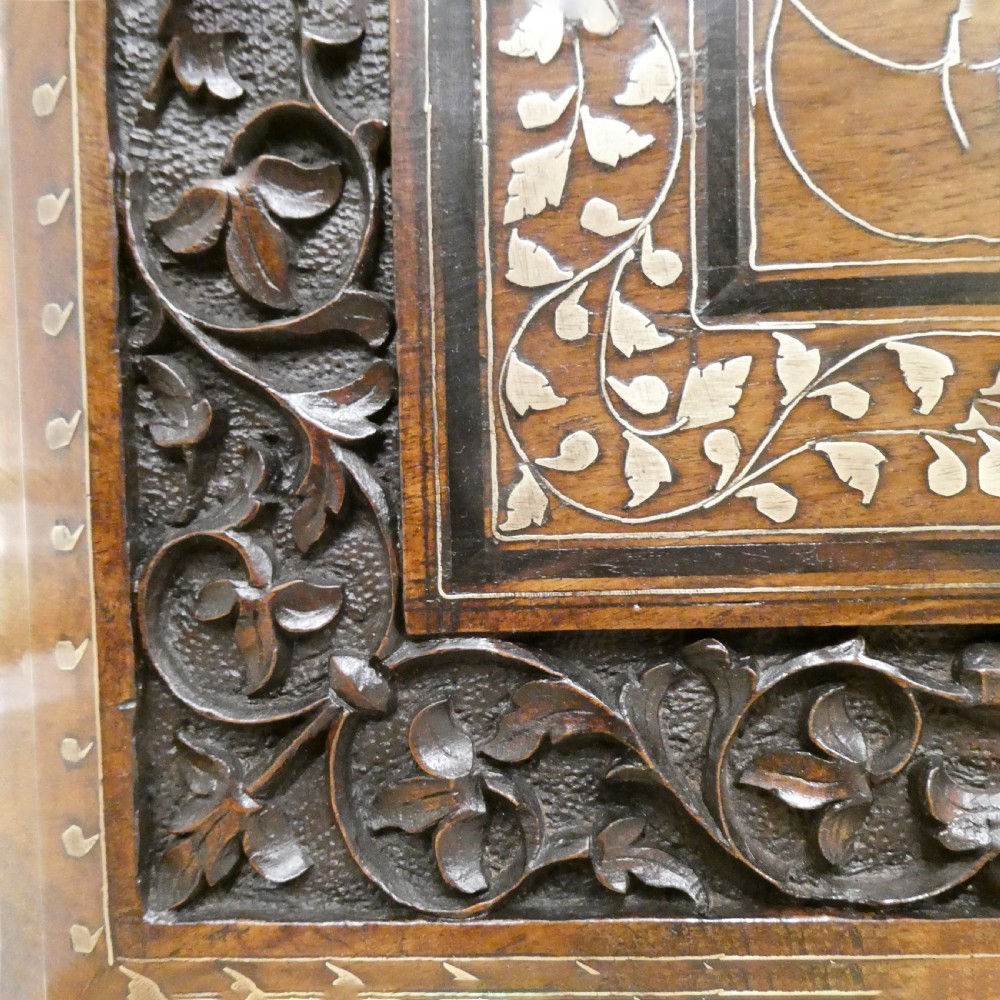 A late 19th-century square Anglo-Indian side table featuring brass inlay with a central star motif and pierced carved wood aprons. View V