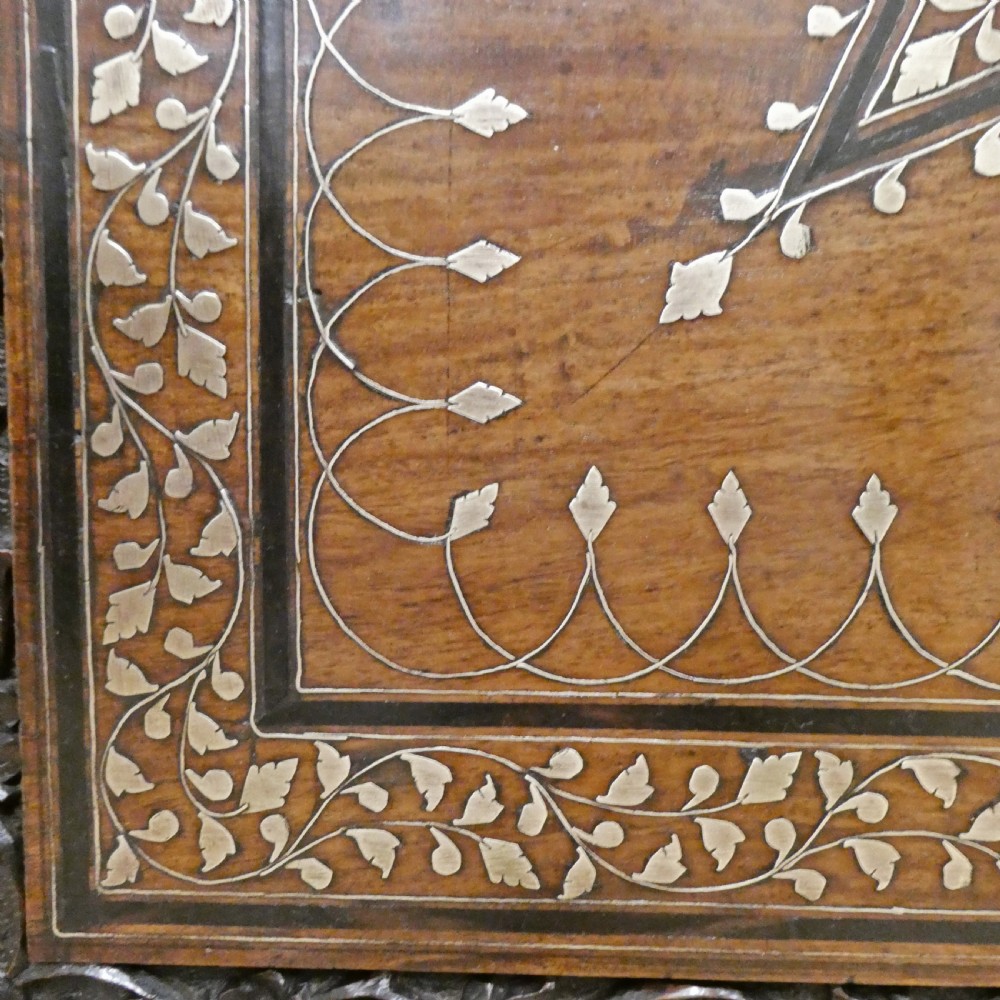 A late 19th-century square Anglo-Indian side table featuring brass inlay with a central star motif and pierced carved wood aprons. View VI