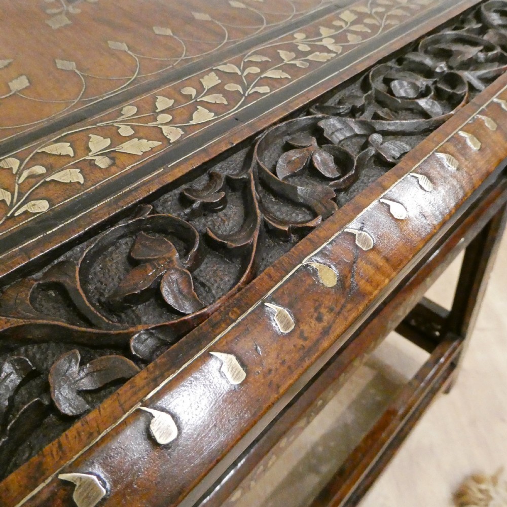 A late 19th-century square Anglo-Indian side table featuring brass inlay with a central star motif and pierced carved wood aprons. View VIII
