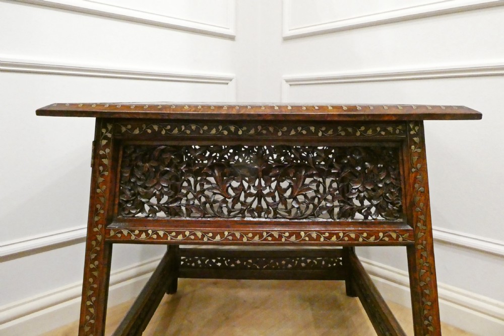 A late 19th-century square Anglo-Indian side table featuring brass inlay with a central star motif and pierced carved wood aprons. View X