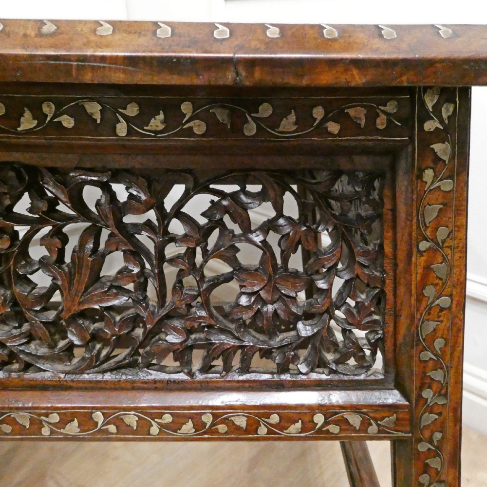 A late 19th-century square Anglo-Indian side table featuring brass inlay with a central star motif and pierced carved wood aprons. View XI