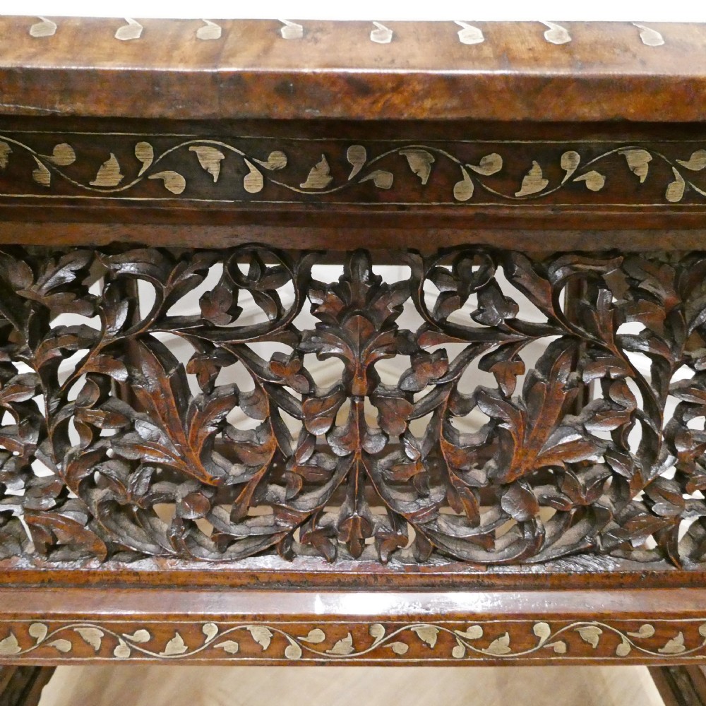 A late 19th-century square Anglo-Indian side table featuring brass inlay with a central star motif and pierced carved wood aprons. View XII