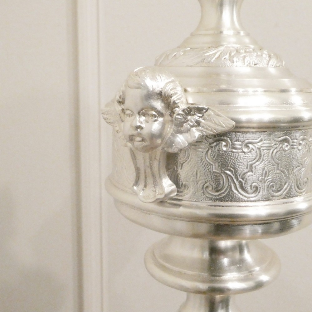 An early 20th-century silver-plated standard lamp featuring a turned column, cast base, and a cream scalloped lampshade with fringe detailing. View III