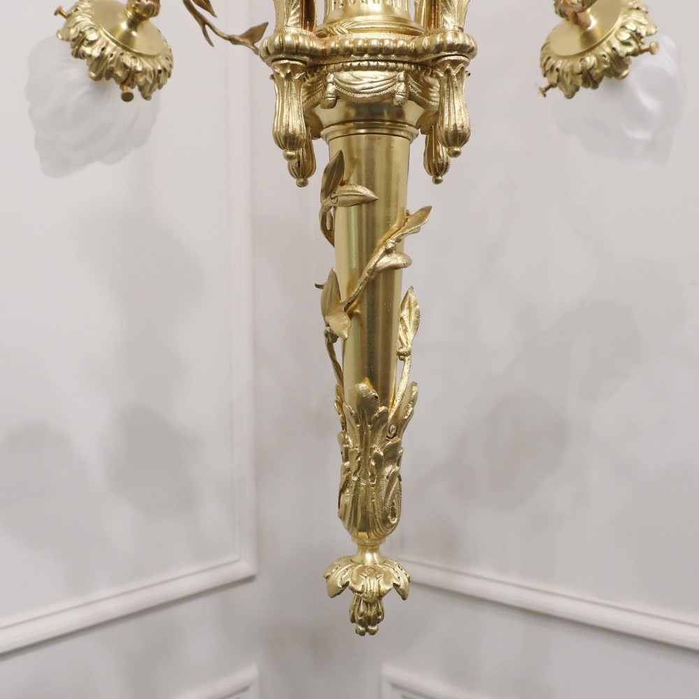 A French Neoclassical style gilt bronze chandelier featuring a central lyre-shaped stem and two outward-curving arms with frosted glass shades. View XI
