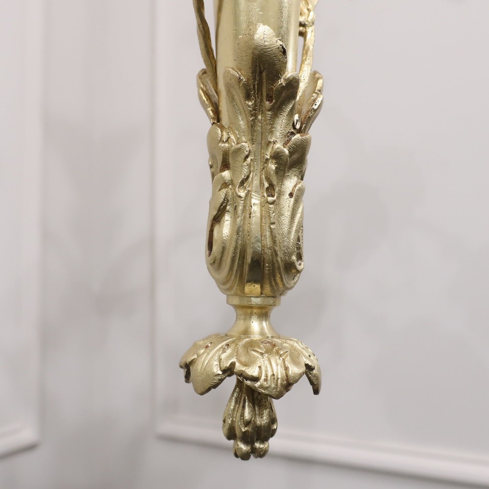 A French Neoclassical style gilt bronze chandelier featuring a central lyre-shaped stem and two outward-curving arms with frosted glass shades. View XIII