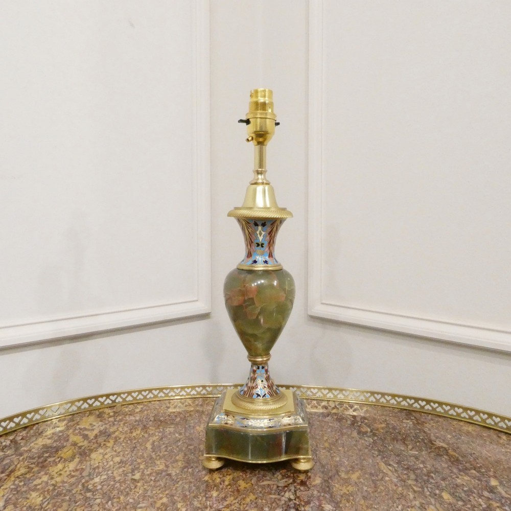 A pair of French table lamps featuring urn-shaped green onyx columns detailed with polychrome champleve enamelling and topped with pleated white shades. View II