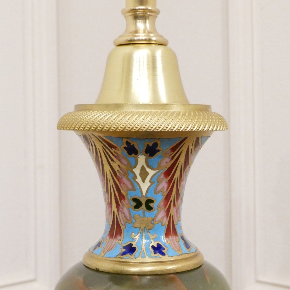 A pair of French table lamps featuring urn-shaped green onyx columns detailed with polychrome champleve enamelling and topped with pleated white shades. View III