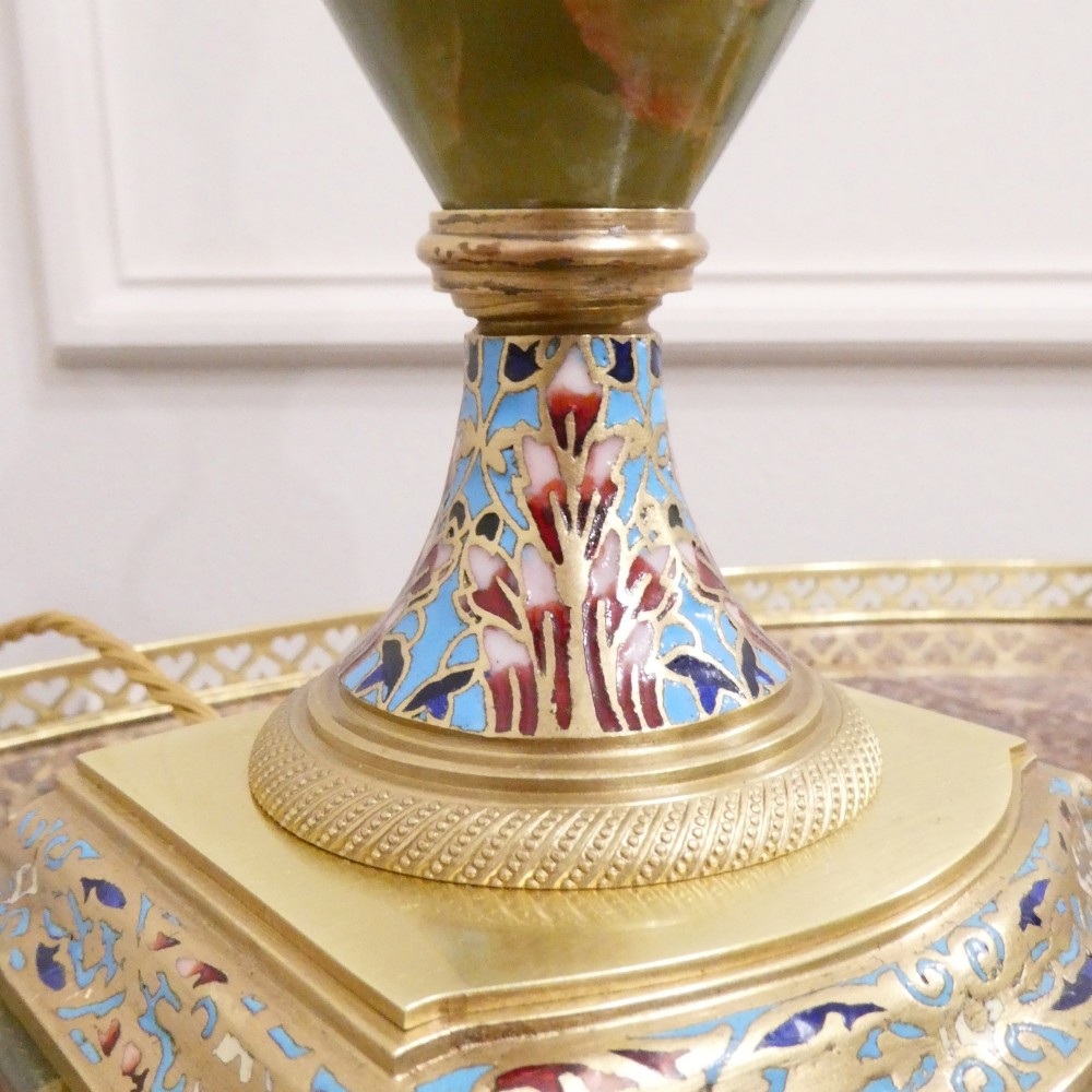 A pair of French table lamps featuring urn-shaped green onyx columns detailed with polychrome champleve enamelling and topped with pleated white shades. View VI