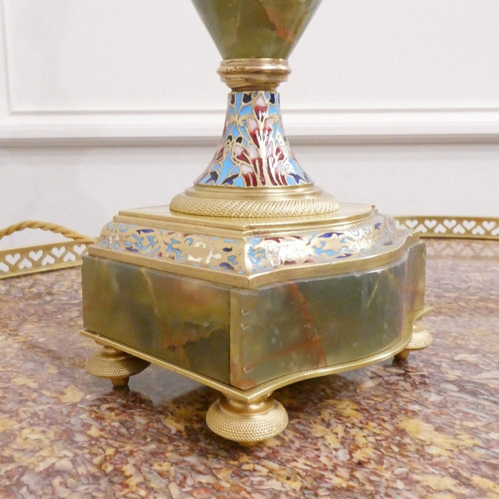 A pair of French table lamps featuring urn-shaped green onyx columns detailed with polychrome champleve enamelling and topped with pleated white shades. View VII