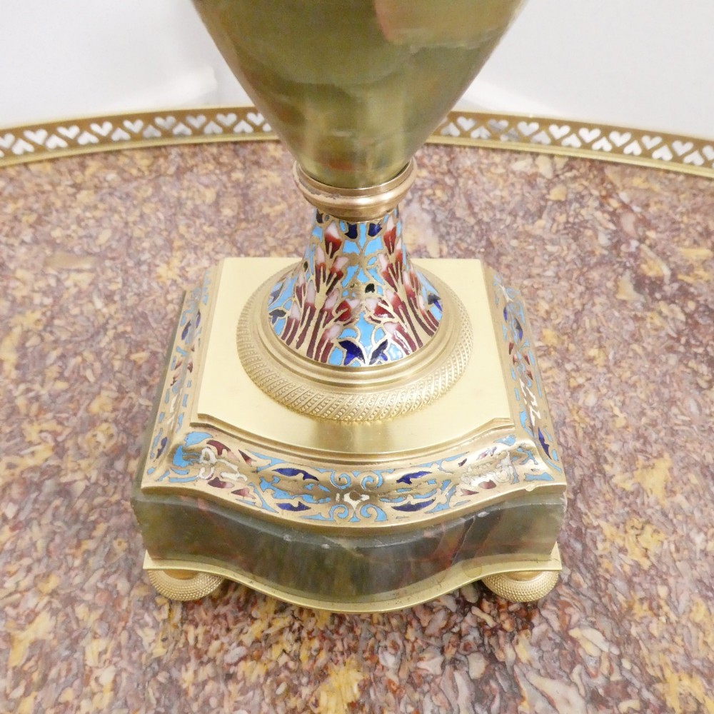A pair of French table lamps featuring urn-shaped green onyx columns detailed with polychrome champleve enamelling and topped with pleated white shades. View VIII