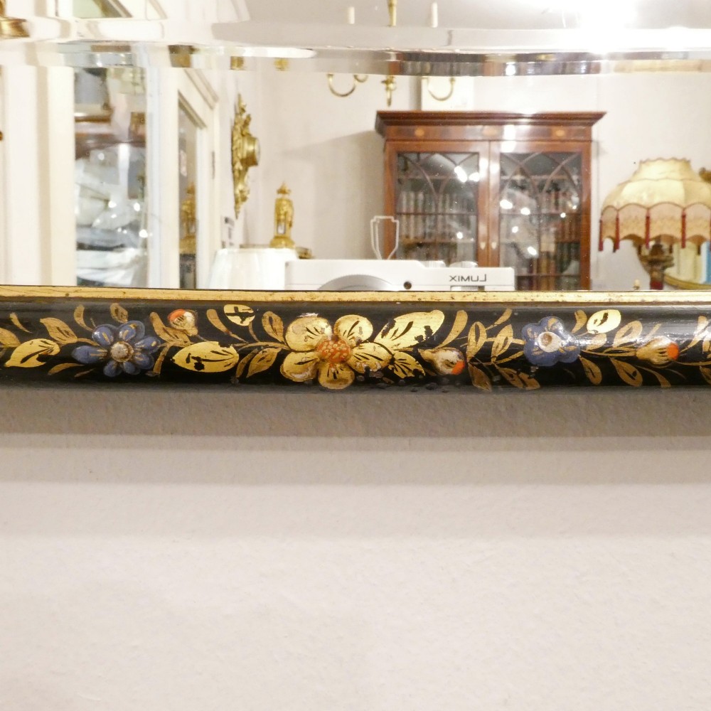 An arched wall mirror with a dark lacquered frame featuring gilded Chinoiserie motifs and segmented glass plates. View VII