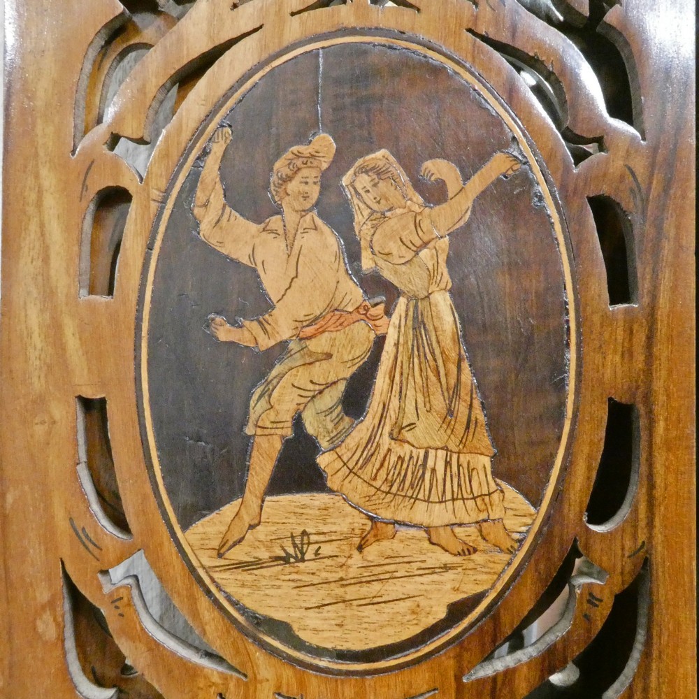 A fretted walnut triptych dressing table mirror featuring central oval glass plates surrounded by openwork carved scroll patterns and inlaid timber panels. View V