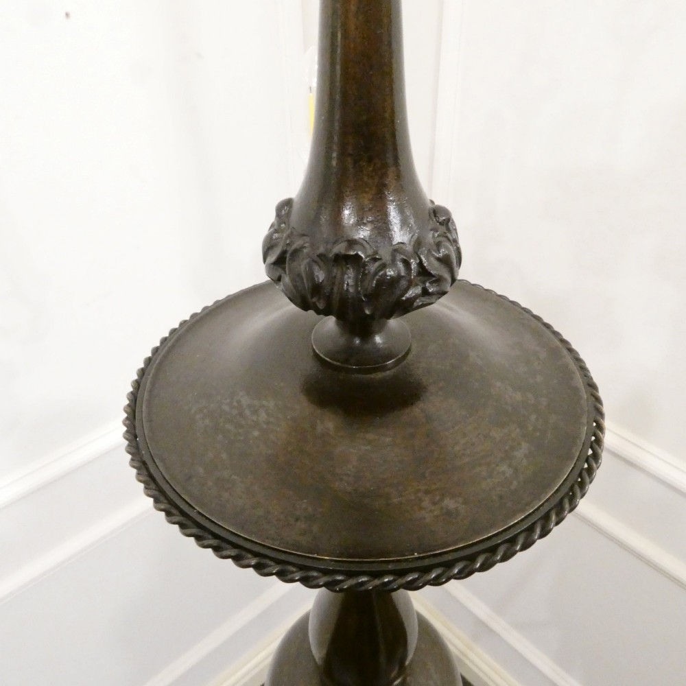 An early 20th-century Dutch bronze two-light chandelier featuring a baluster-turned central stem and curved scrolling arms. View XIV