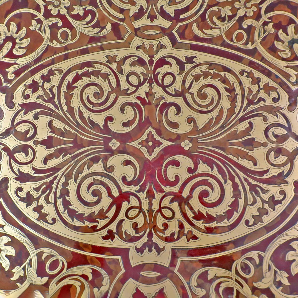 A French Louis XV style Boulle games table featuring brass and tortoiseshell marquetry, gilded ormolu mounts, and cabriole legs. View III