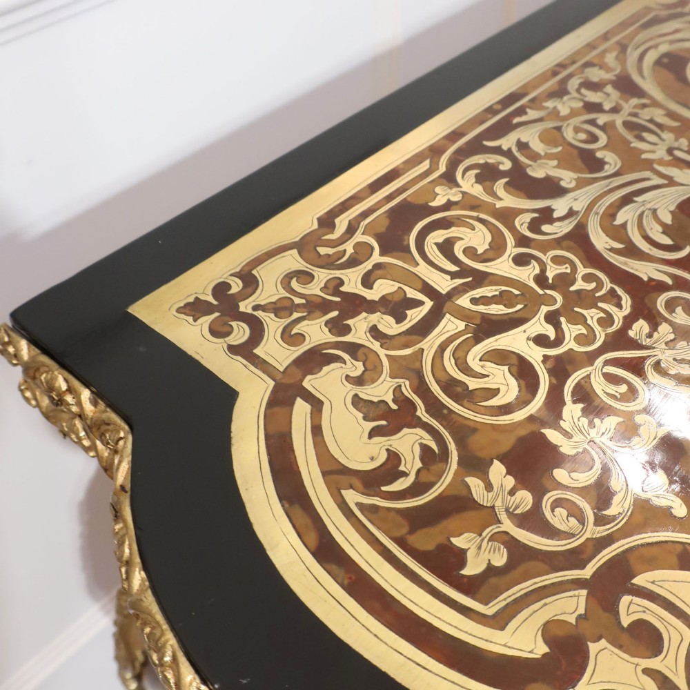A French Louis XV style Boulle games table featuring brass and tortoiseshell marquetry, gilded ormolu mounts, and cabriole legs. View IV
