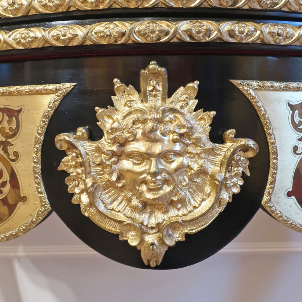 A French Louis XV style Boulle games table featuring brass and tortoiseshell marquetry, gilded ormolu mounts, and cabriole legs. View IX