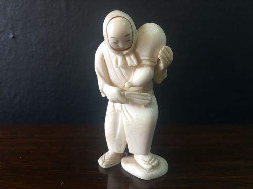 MEIJI PERIOD IVORY NETSUKE OF MAN WITH HAPPYANGRY FACES C19TH - ADDITIONAL PHOTO 1