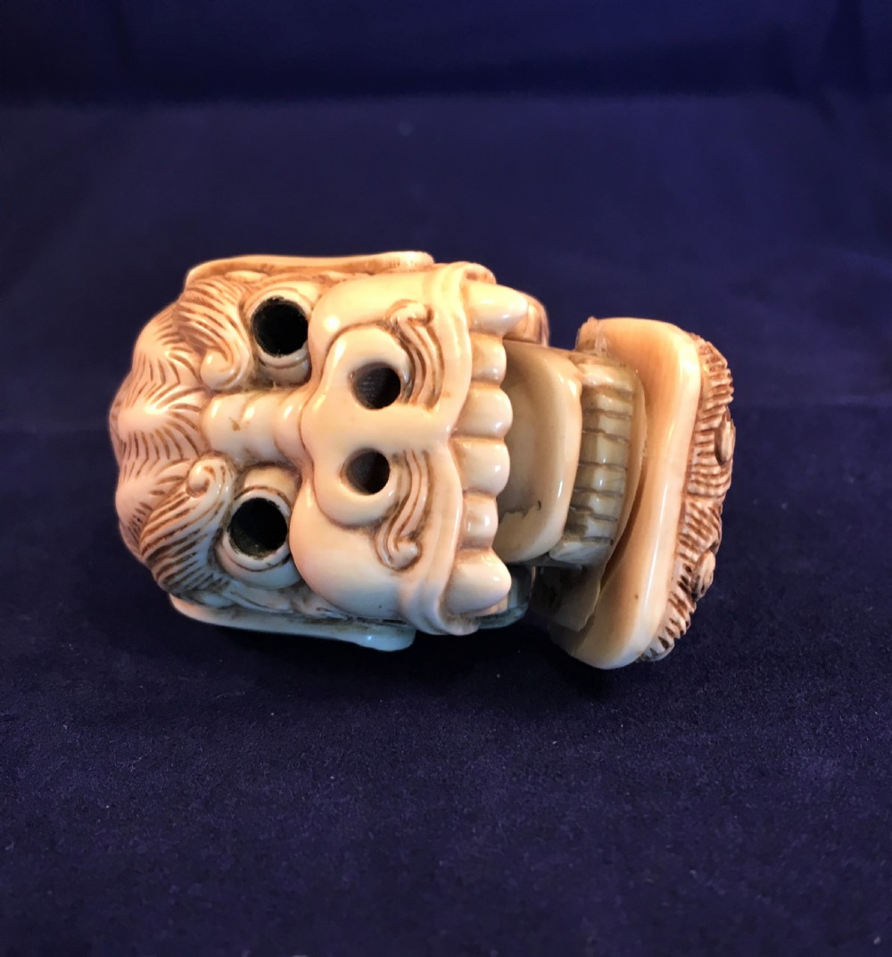 Meiji Period (1868-1912) Ivory Netsuke of a Shishi Head (with moveable jaw) SIGNED View II