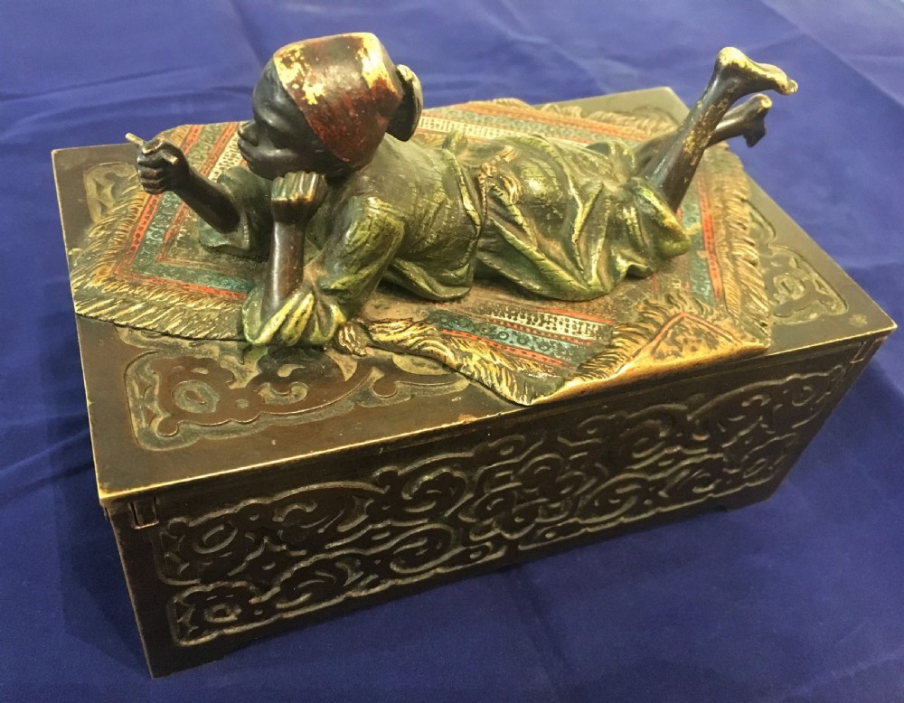 Austrian Cold Painted Bronze Table Casket with Arab Boy Reclining Upon an Exotic Carpet  c1900