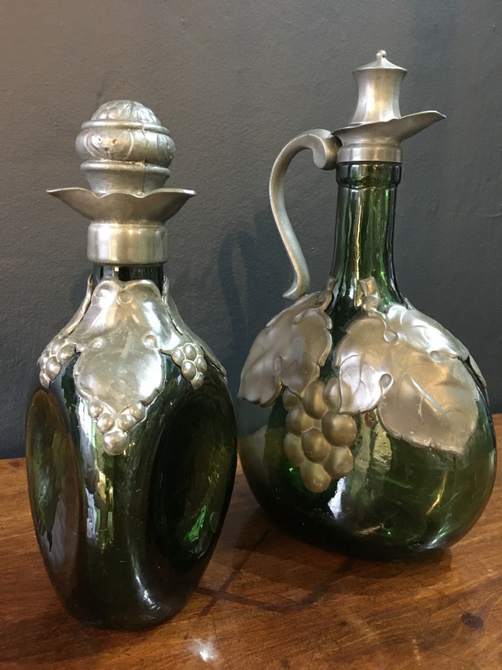 Two Art Nouveau Glass Bottles with Pewter Overlay Decoration & Stoppers C19th View II