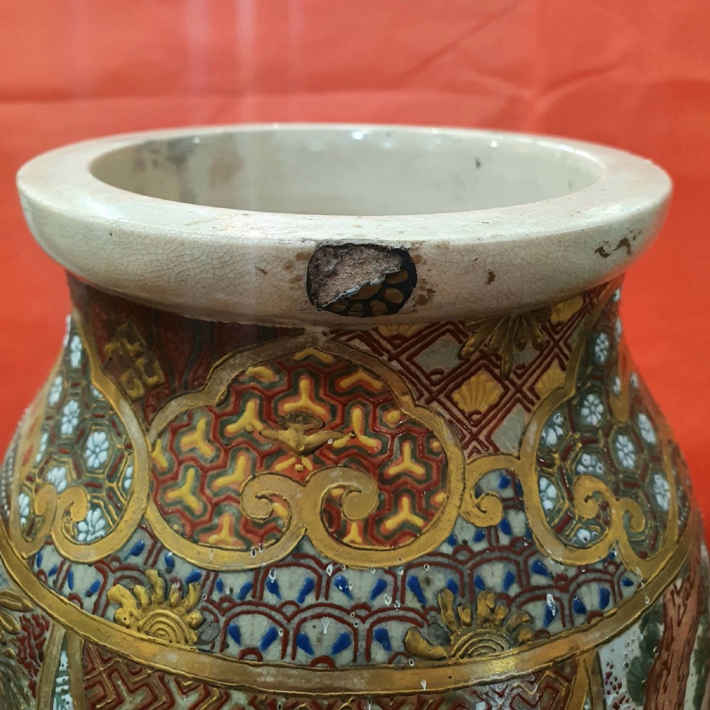 A pair of Japanese Satsuma earthenware vases decorated with detailed gilded panels and painted figures. View IX
