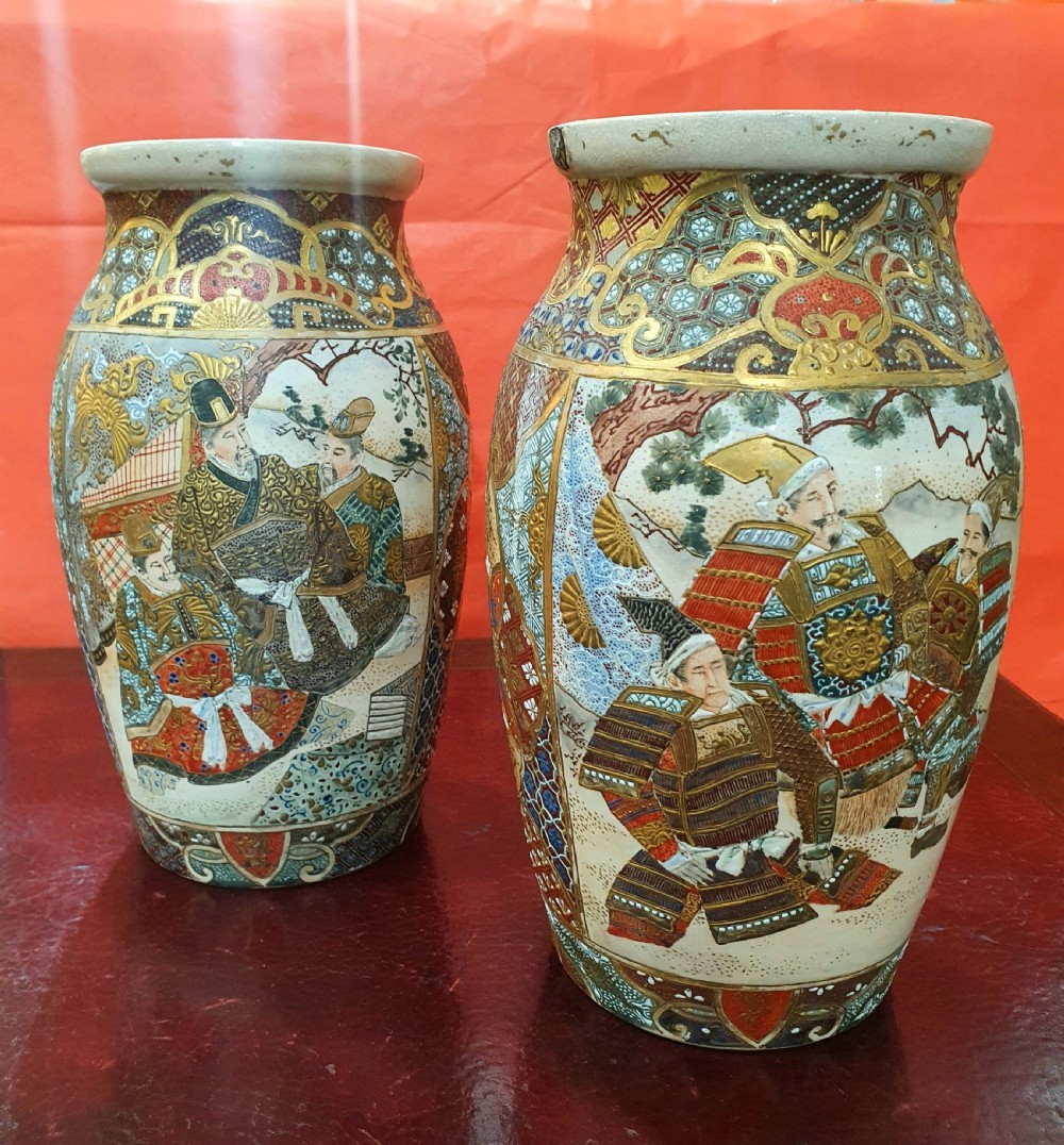 A pair of Japanese Satsuma earthenware vases decorated with detailed gilded panels and painted figures. View XIV
