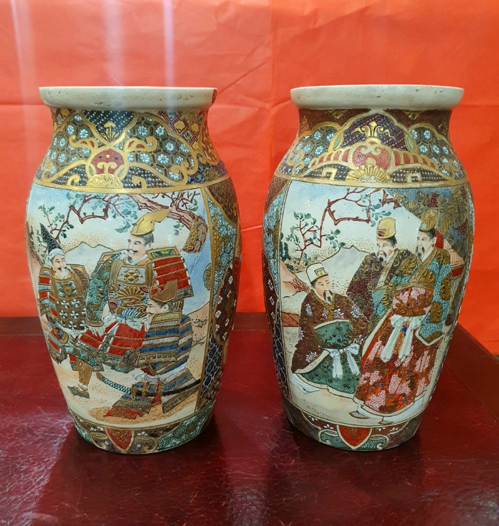A pair of Japanese Satsuma earthenware vases decorated with detailed gilded panels and painted figures. View XV