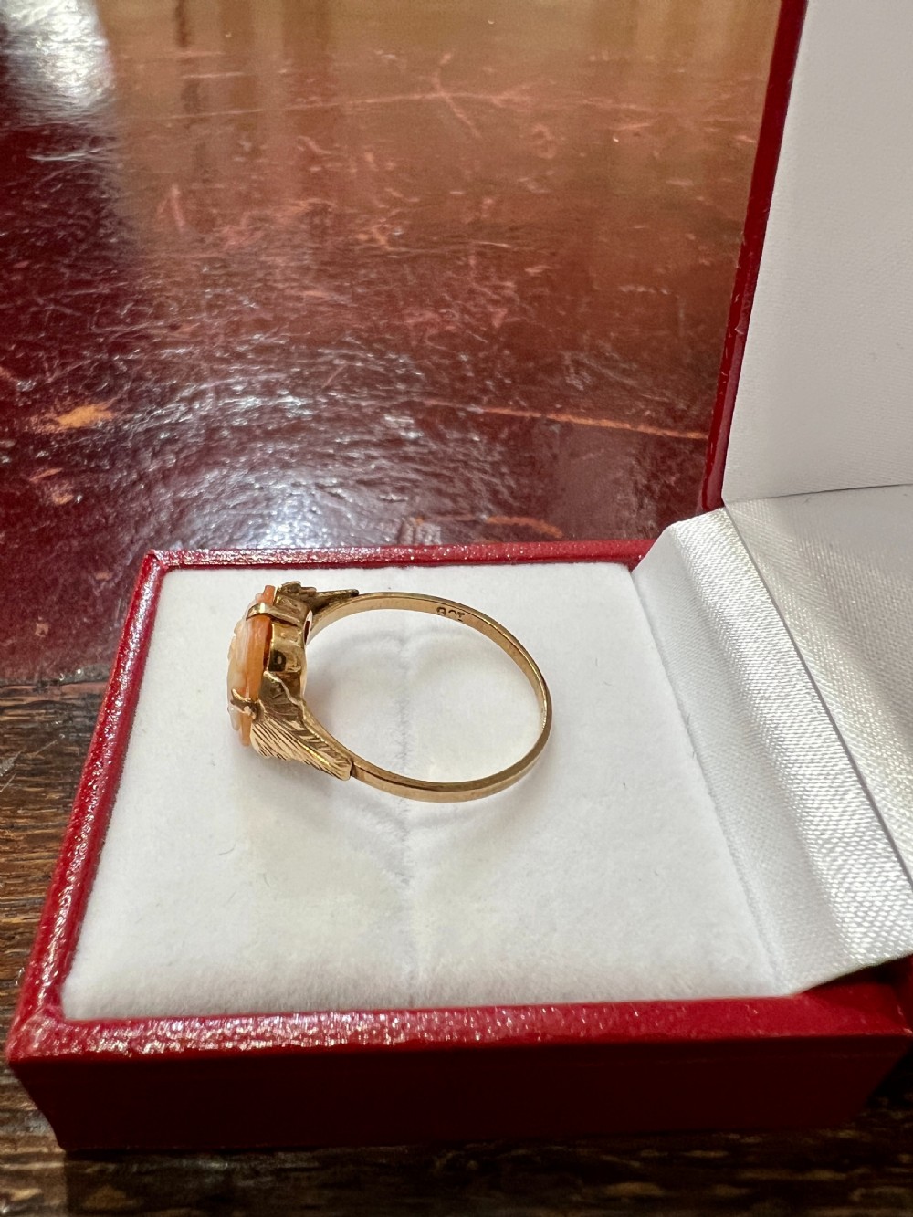 An Art Deco 9ct gold ring featuring a rectangular carved shell cameo displaying a female profile in relief. View III
