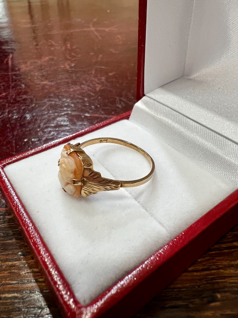 An Art Deco 9ct gold ring featuring a rectangular carved shell cameo displaying a female profile in relief. View IV