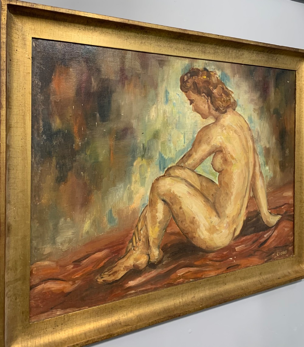 An Art Deco oil painting depicting a seated female nude in profile against a textured background, rendered in warm ochre tones and set in a gilded frame. View IV