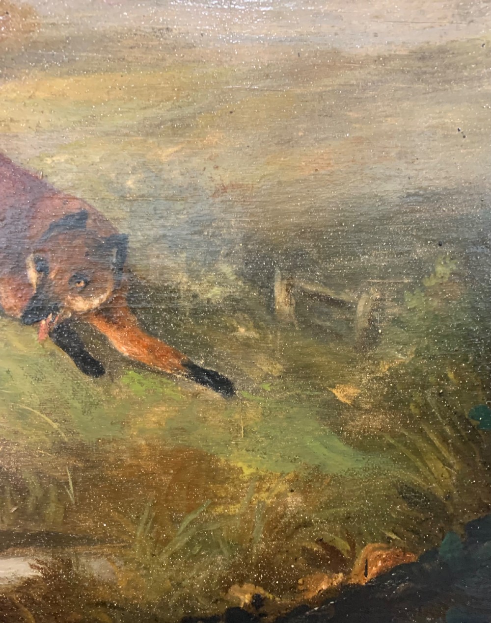 An early nineteenth-century oil painting on a wooden panel depicting two hunting hounds in pursuit of a fox across a landscape, set within a dark moulded frame. View VIII