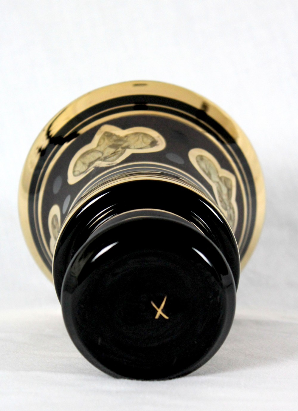 An Art Deco black hyalite glass vase featuring horizontal gold bands and stylized floral medallions. View III