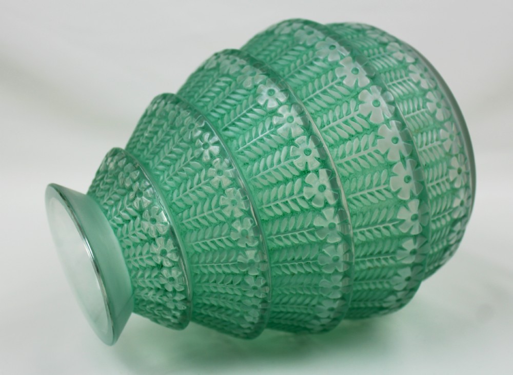A green frosted glass Art Deco vase featuring tiered conical bands decorated with relief floral and leaf patterns. View IV