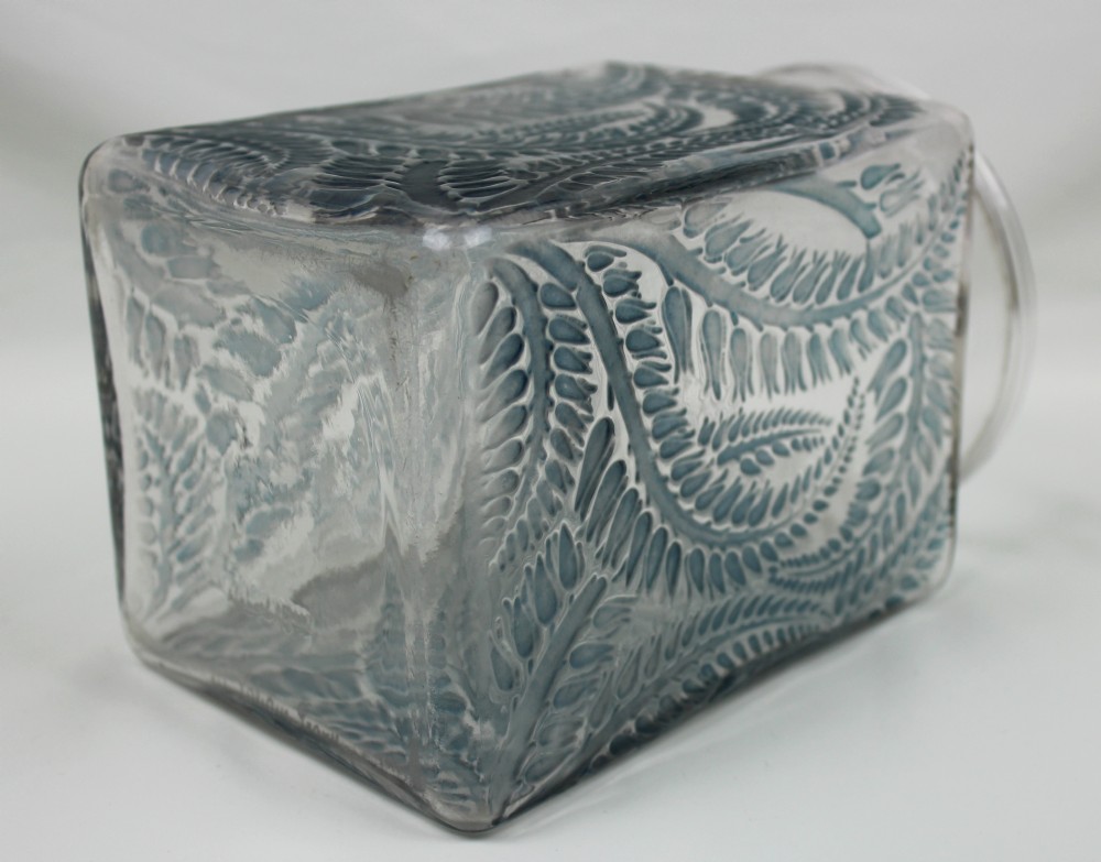 A square Rene Lalique Myrrhis clear glass vase featuring relief-moulded botanical motifs highlighted with blue staining. View VI
