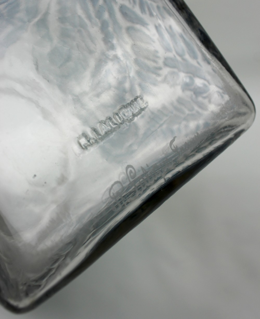 A square Rene Lalique Myrrhis clear glass vase featuring relief-moulded botanical motifs highlighted with blue staining. View VII