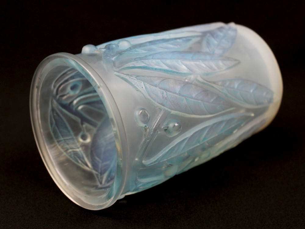 A cylindrical Art Deco opalescent glass vase decorated with relief-moulded laurel leaves and berries tinted in subtle blue. View IV