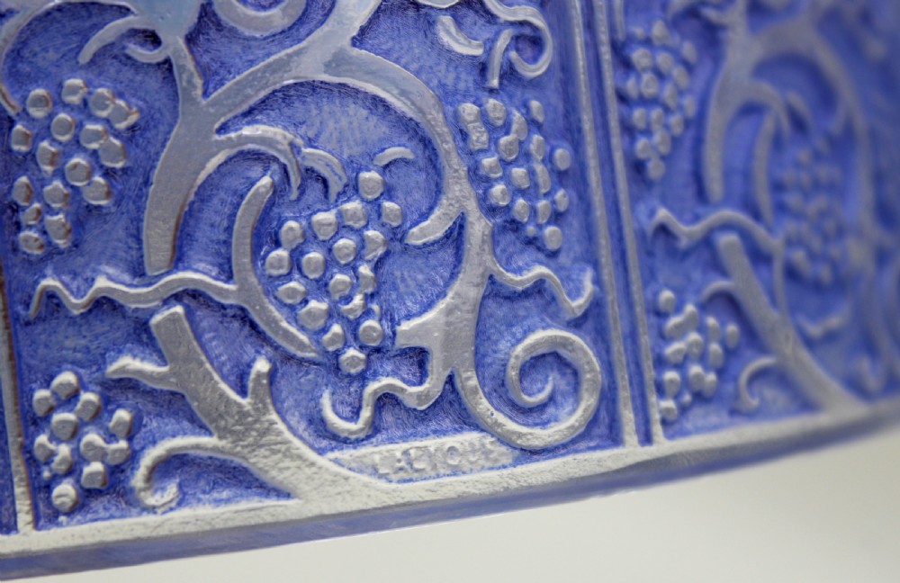 A circular Art Deco blue-stained glass powder box featuring moulded relief patterns of birds, grapevines, and polished glass cabochons. View VI