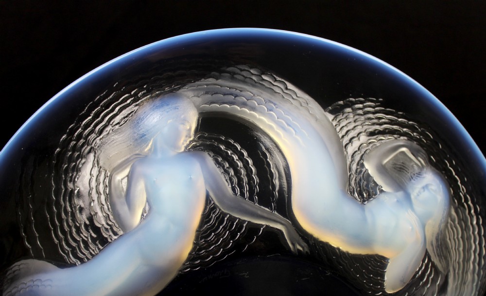 An Art Deco circular opalescent glass bowl featuring moulded relief figures of five swirling sirens surrounding the centre. View III