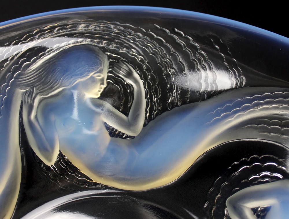 An Art Deco circular opalescent glass bowl featuring moulded relief figures of five swirling sirens surrounding the centre. View IV