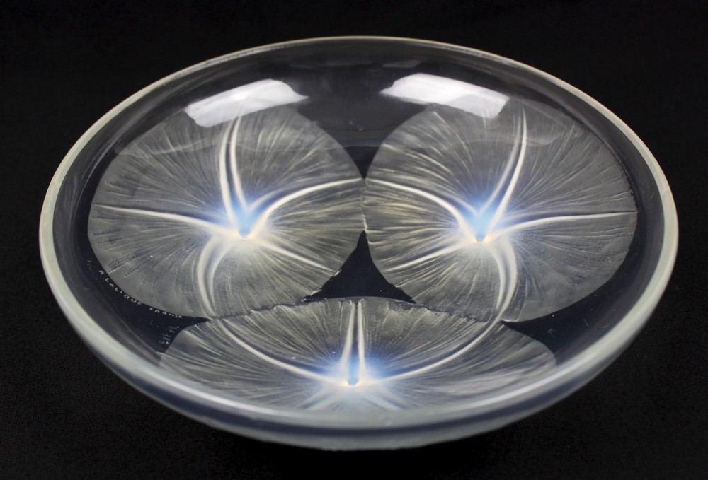 A circular Rene Lalique opalescent glass bowl featuring three relief-moulded morning glory flowers whose stems extend to form feet on the underside. View II